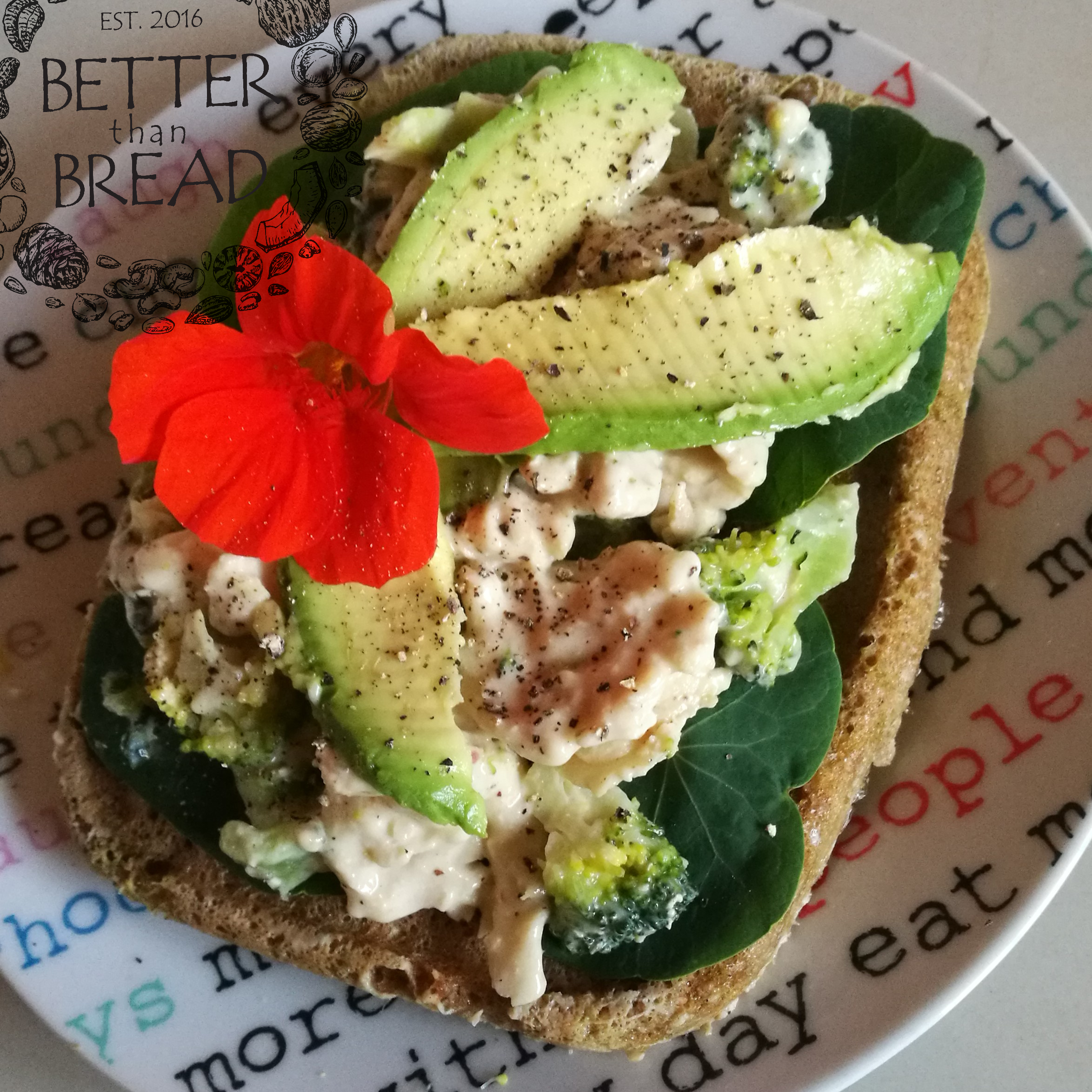 Better Than Bread's delicious seed bread, topped with avocado and nasturtiums for spice.
